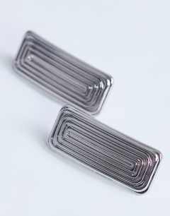 Model wearing Carmen rectangle stud earring in silver tone