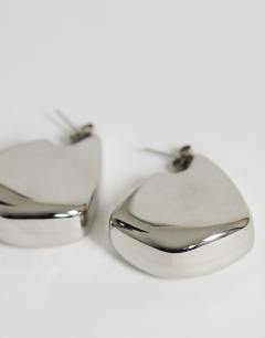 Model wearing Casey waterproof chunky hoop earrings in stainless silver