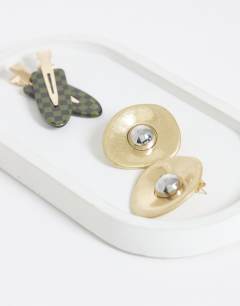 Model wearing Cece statement round stud earrings in gold tone