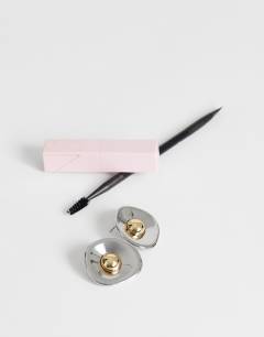 Model wearing Cece statement round stud earrings in silver tone