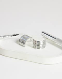 Model wearing Celeste diamante hoop earrings in silver