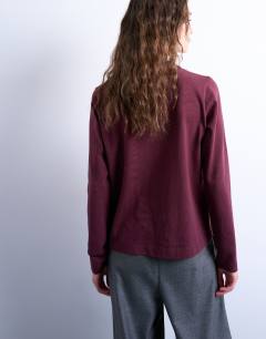 Model wearing Chamonix graphic boxy long sleeve tee in burgundy