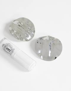 Model wearing Chantal large statement disc earrings in silver tone