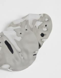 Model wearing Chantal large statement disc earrings in silver tone