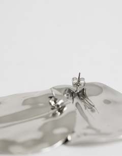 Model wearing Chantal large statement disc earrings in silver tone