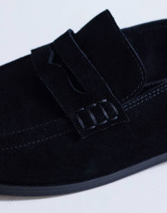 Model wearing Charlie real leather flat loafer in black suede