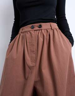 Model wearing Check extreme balloon trouser in brown