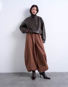 Model wearing Check extreme balloon trouser in brown