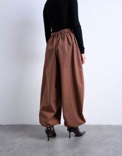 Model wearing Check extreme balloon trouser in brown