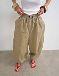 Model wearing Check extreme balloon trouser in neutral