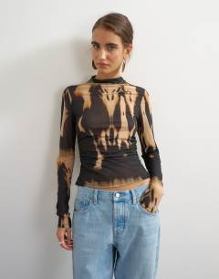 Model wearing Check high neck mesh long sleeve top in mono print