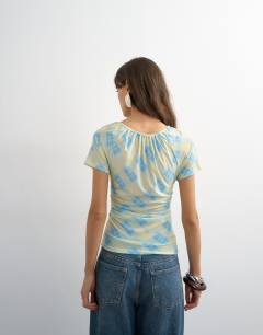 Model wearing Check mesh key hole detail short sleeve top in blue