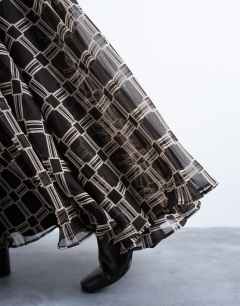 Model wearing Check print full circle maxi skirt in chocolate