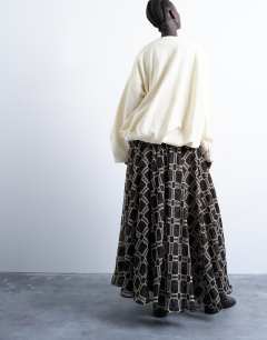 Model wearing Check print full circle maxi skirt in chocolate