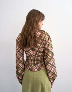 Model wearing Check print long sleeve ruched side top in multi