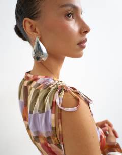 Model wearing Check ruched detail top in red