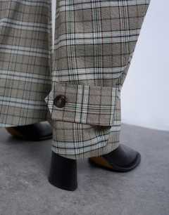 Model wearing Check tailored barrel leg trouser