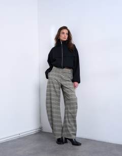Model wearing Check tailored barrel leg trouser
