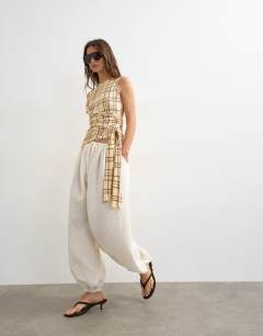 Model wearing Check wrap drape tank with tie in buttermilk  