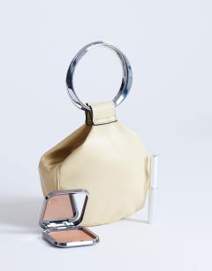 Model wearing Cherry metal handle grab bag in buttermilk