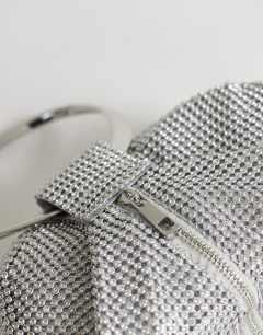 Model wearing Cherry metal handle grab bag in silver diamante