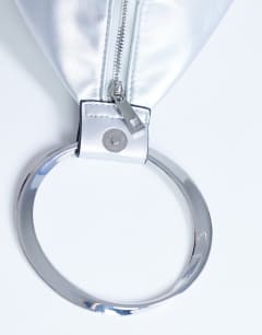 Model wearing Cherry metal handle grab bag in silver