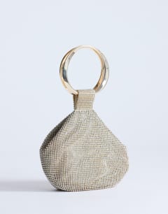 Model wearing Cherry small metal handle grab bag in gold diamante