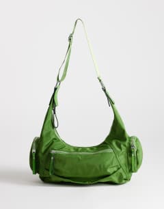 Model wearing Cheryl nylon crossbody bag in green