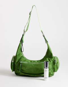 Model wearing Cheryl nylon crossbody bag in green