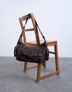 Model wearing Cheryl nylon crossbody bag in leopard