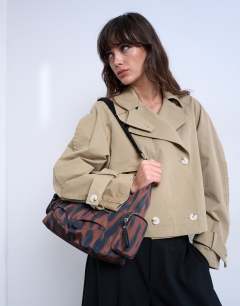 Model wearing Cheryl nylon crossbody bag in leopard