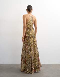 Model wearing Chiffon cut away racer neck full skirt maxi dress in abstract animal