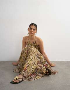 Model wearing Chiffon cut away racer neck full skirt maxi dress in abstract animal