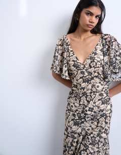 Model wearing Chiffon flutter sleeve maxi dress in floral print