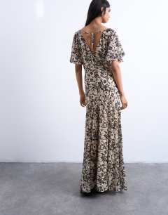 Model wearing Chiffon flutter sleeve maxi dress in floral print