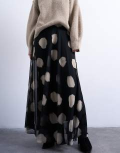 Model wearing Chiffon full maxi skirt in mono spot print