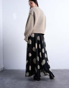 Model wearing Chiffon full maxi skirt in mono spot print