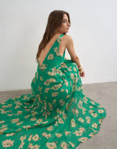 Model wearing Chiffon maxi dress with seam detail in green floral