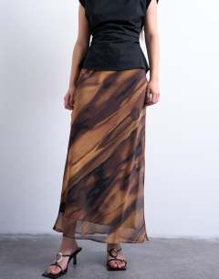 Model wearing Chiffon midi skirt in woodgrain