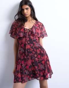 Model wearing Chiffon mini tea dress in rust floral print