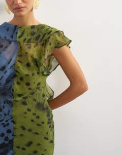 Model wearing Chiffon scarf detail maxi dress in half and half khaki and blue abstract spot print