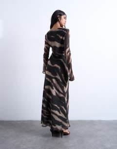 Model wearing Chiffon scoop neck column maxi dress in blurred animal print