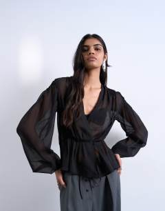Model wearing Chiffon sheer panel long sleeve blouse in black