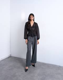 Model wearing Chiffon sheer panel long sleeve blouse in black