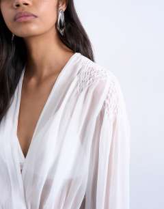 Model wearing Chiffon sheer panel long sleeve blouse in ivory