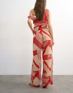Model wearing Chiffon stripe print wide leg trouser co-ord in red