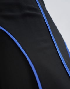 Model wearing Chiffon V neck dropped waist maxi dress in black with blue tipping