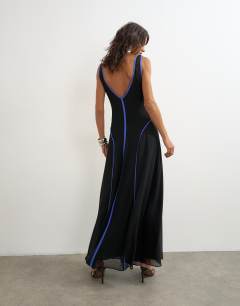Model wearing Chiffon V neck dropped waist maxi dress in black with blue tipping