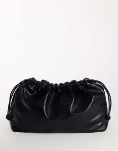 Model wearing Chloe oversized ruched pouch clutch bag in black