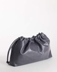 Model wearing Chloe oversized ruched pouch clutch bag in grey
